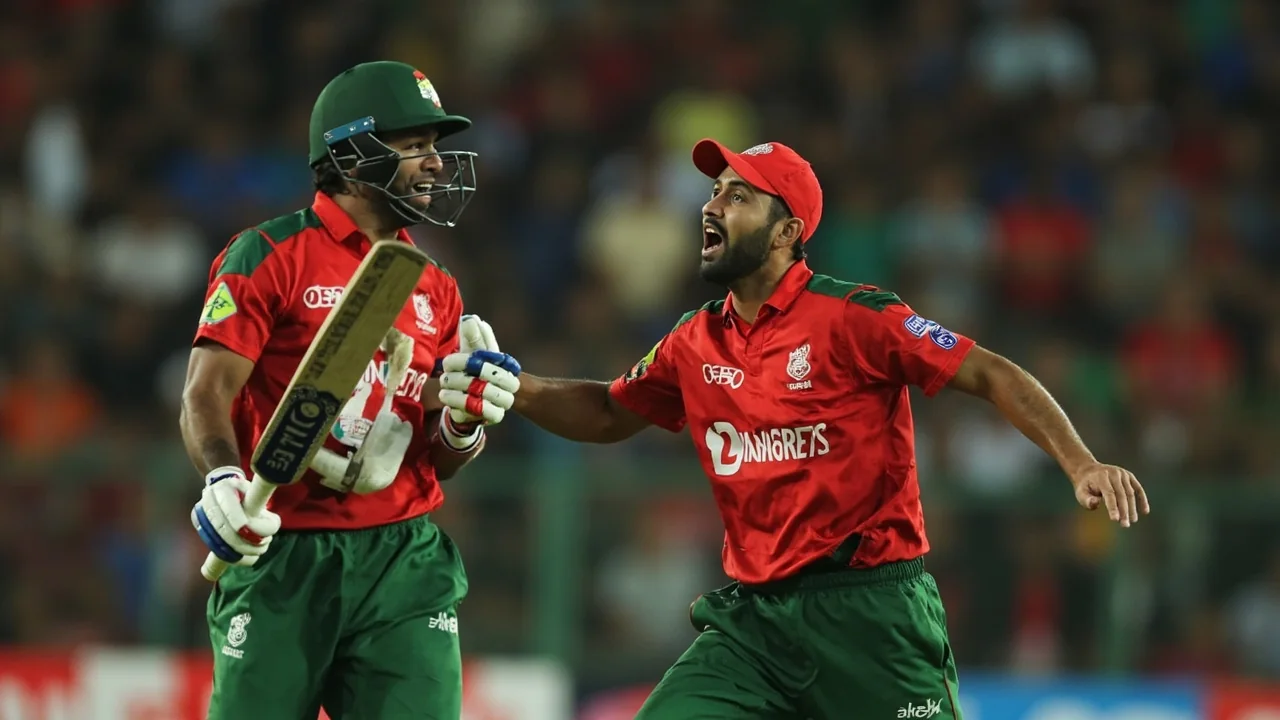 Sideline view of a Bangladesh cricketer during a T20 international fixture, captured with shallow depth of field
